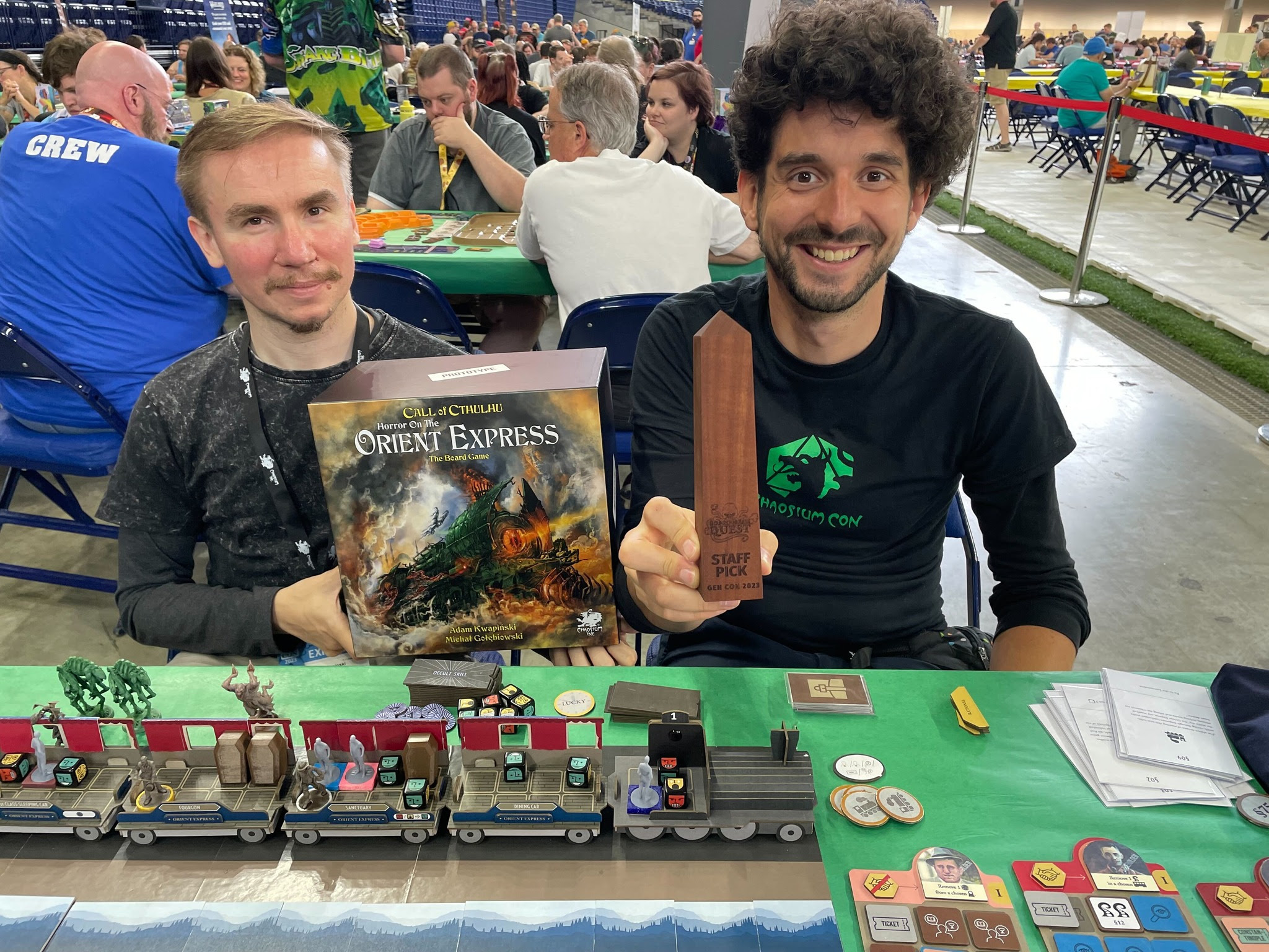 Adam Kwapiński and co-designer Michał Gołąb Gołębiowski at Gen Con 2023, having just received Board Game Quest's "Staff Pick of the Show 2023" award for Horror on the Orient Express the Board Game.